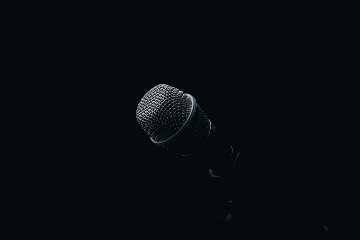 Black and gray microphone against a dark background